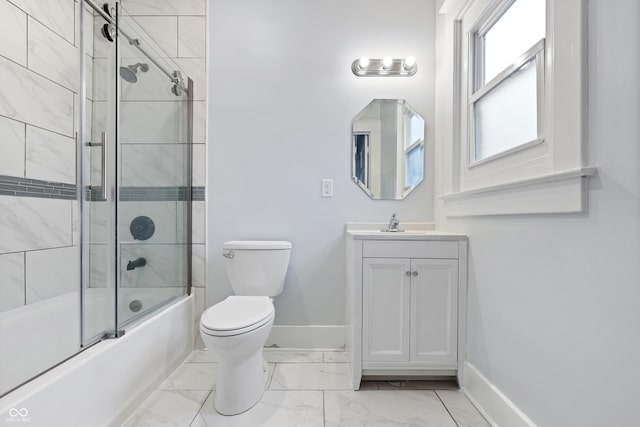 full bathroom with toilet, vanity, and shower / bath combination with glass door