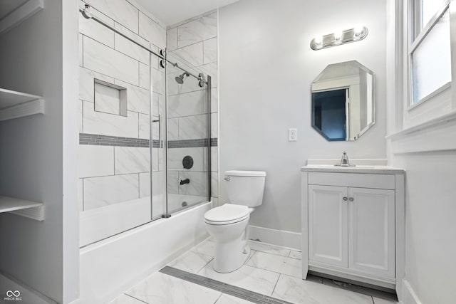 full bathroom with toilet, vanity, and shower / bath combination with glass door