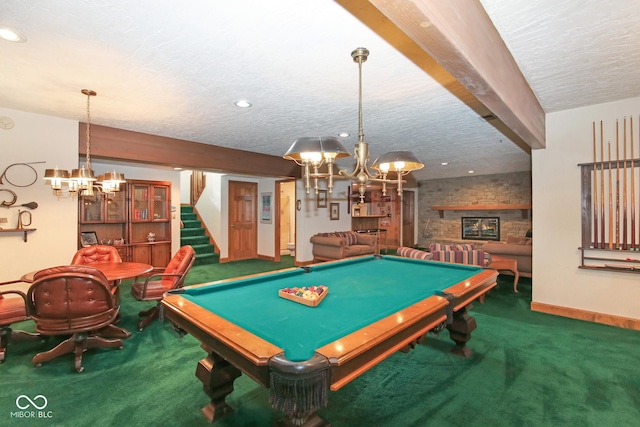 game room featuring carpet, a fireplace, a textured ceiling, and pool table