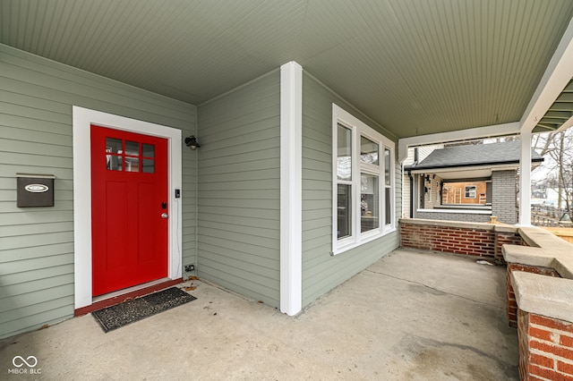 doorway to property featuring covered porch