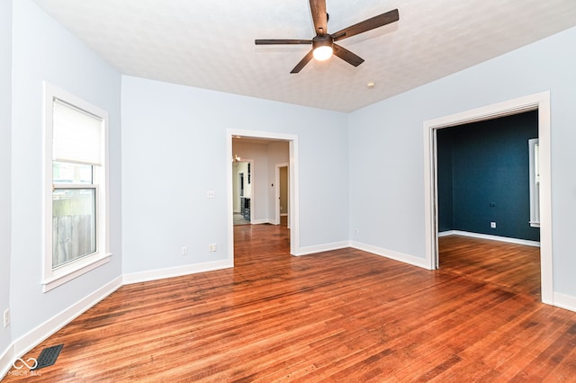 unfurnished room featuring hardwood / wood-style floors and ceiling fan