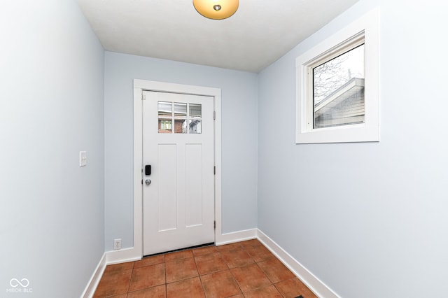 entryway featuring plenty of natural light and tile patterned floors