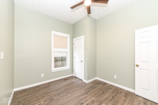 unfurnished bedroom featuring dark hardwood / wood-style floors and ceiling fan