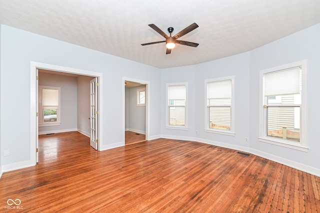 empty room featuring ceiling fan and light hardwood / wood-style flooring