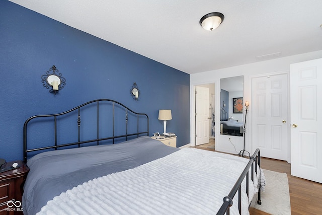 bedroom featuring wood finished floors