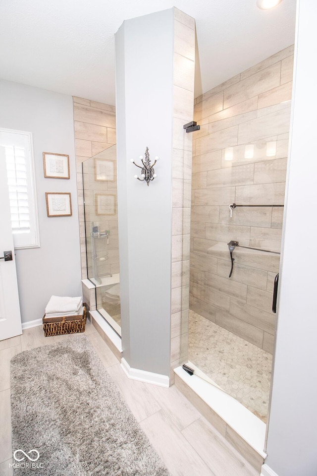 bathroom with a tile shower