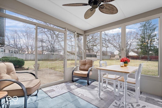 sunroom with a ceiling fan