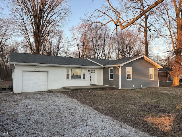 single story home featuring a garage