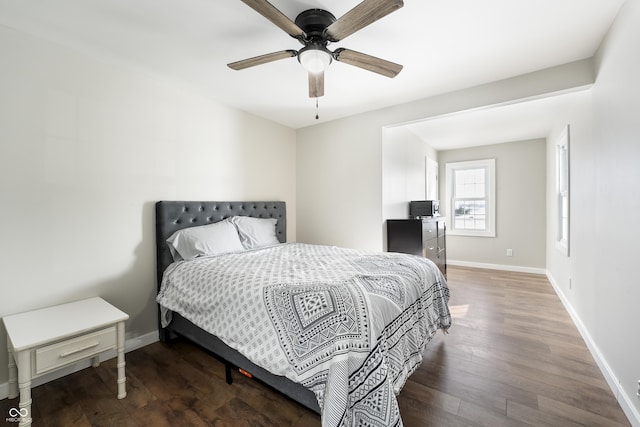 bedroom with dark wood-type flooring and ceiling fan