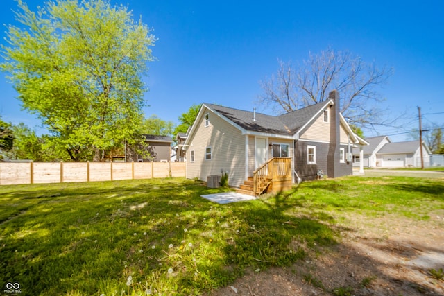 227 W 7th St, Lapel, IN 46051 - view of property exterior featuring a chimney and cooling unit
