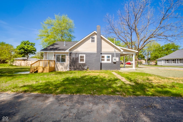 227 W 7th St, Lapel, IN 46051 - view of side of home with a chimney and a lawn