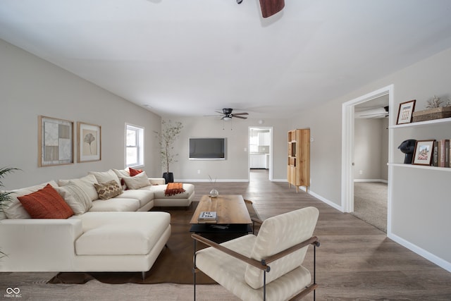 227 W 7th St, Lapel, IN 46051 - living area featuring ceiling fan, wood finished floors, healthy amount of natural light, and a wall unit AC