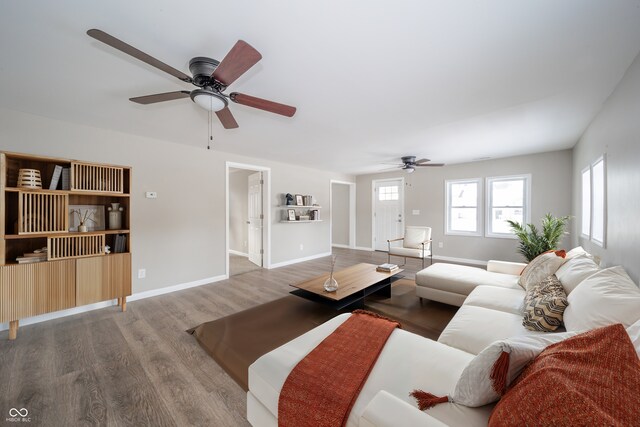 227 W 7th St, Lapel, IN 46051 - living area featuring a ceiling fan, wood finished floors, and baseboards