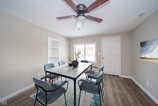 227 W 7th St, Lapel, IN 46051 - dining area with wood finished floors, ceiling fan, baseboards, and built in shelves