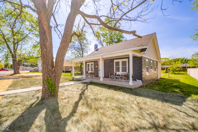 227 W 7th St, Lapel, IN 46051 - back of property with a yard, a patio area, and a shingled roof