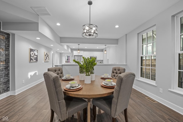 dining area featuring light wood-type flooring