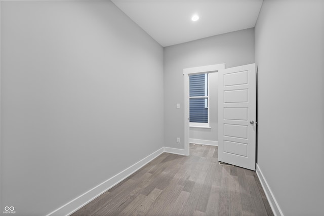 empty room with light hardwood / wood-style flooring