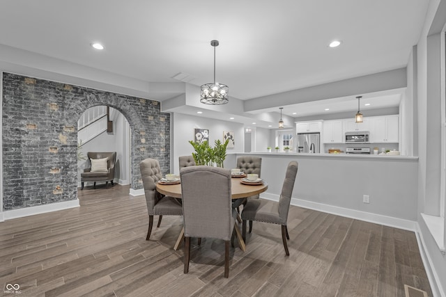 dining area with hardwood / wood-style flooring