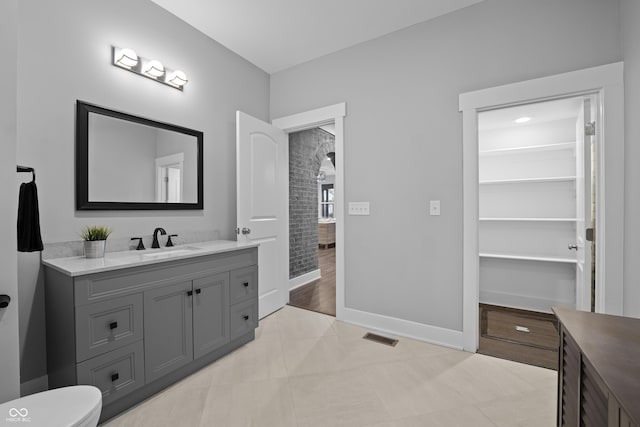 bathroom with vanity and tile patterned floors