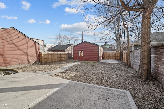 view of yard featuring a patio area and a shed