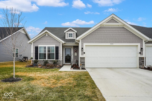 craftsman-style house with a garage and a front yard