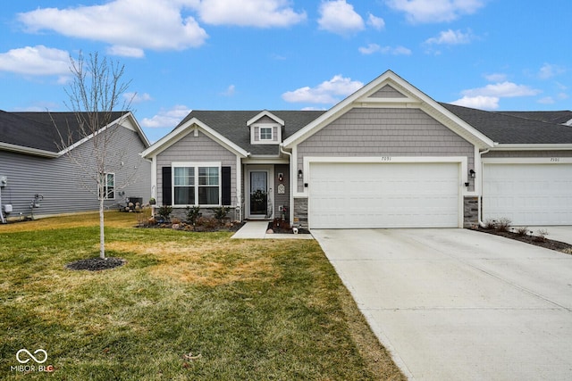 craftsman-style home with a garage and a front yard