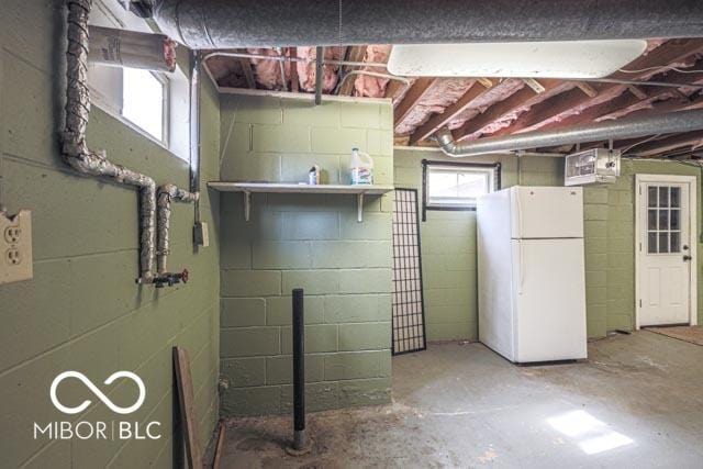 basement with white fridge