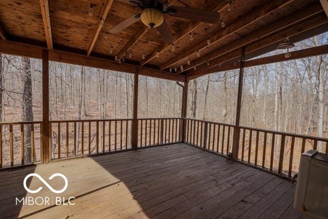 wooden terrace featuring ceiling fan