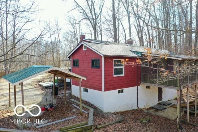 view of home's exterior with a carport