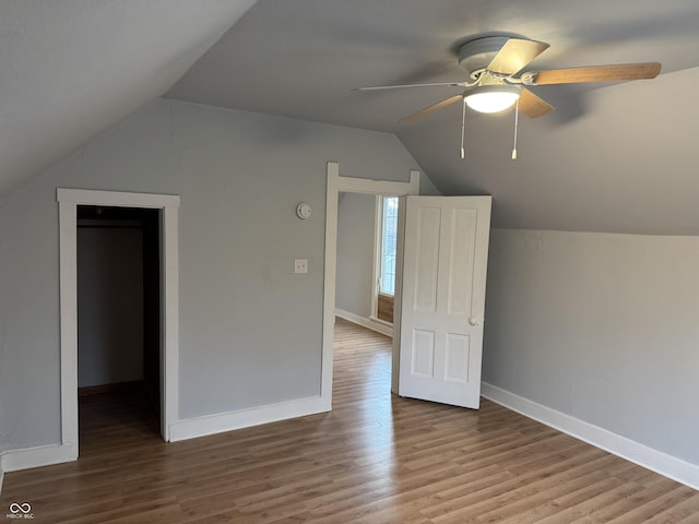 bonus room with vaulted ceiling, hardwood / wood-style floors, and ceiling fan