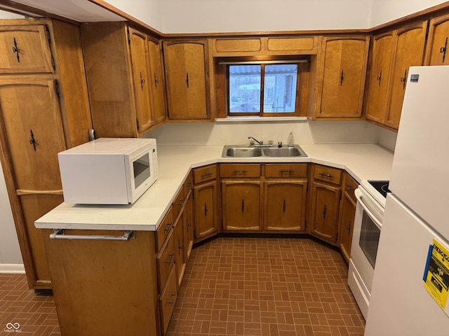 kitchen with white appliances and sink