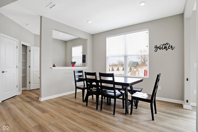 dining room with recessed lighting, baseboards, visible vents, and light wood-style floors