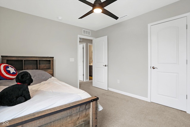 bedroom featuring carpet flooring, a ceiling fan, baseboards, and visible vents