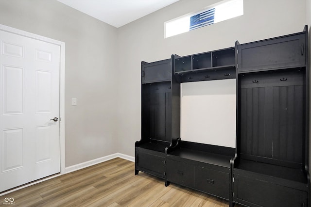 mudroom with baseboards and light wood finished floors