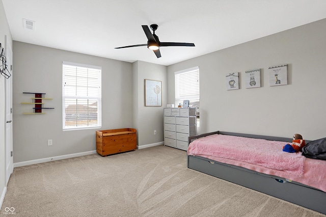 bedroom featuring carpet floors, baseboards, visible vents, and ceiling fan