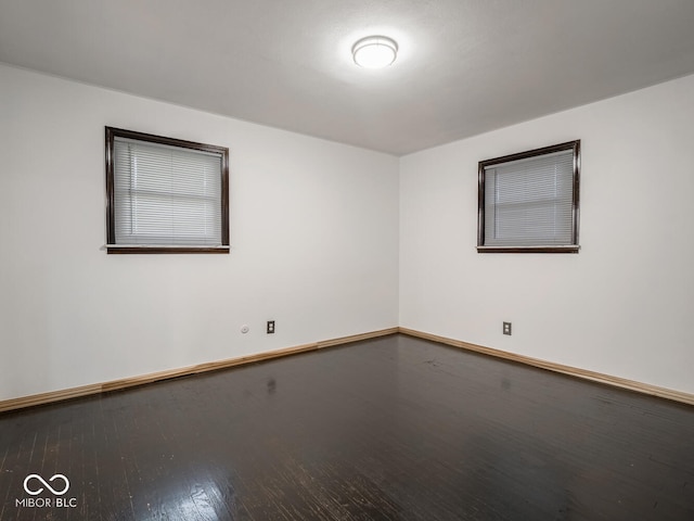 empty room with wood-type flooring