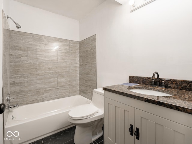 full bathroom featuring tiled shower / bath combo, vanity, and toilet