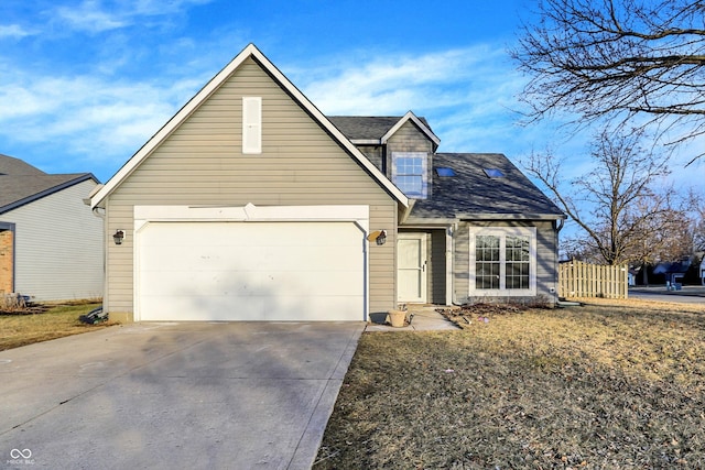 traditional home with driveway, a shingled roof, and an attached garage