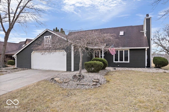 view of front of property with a garage, driveway, a chimney, and a front yard