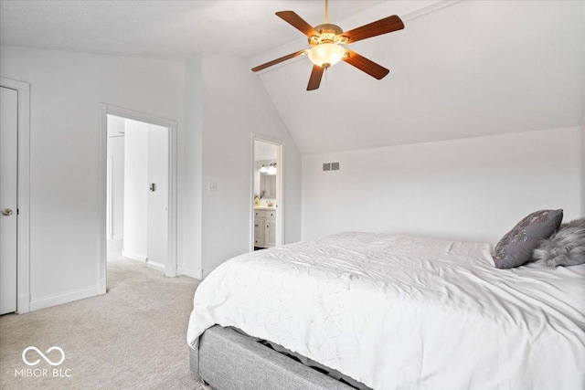 bedroom featuring light colored carpet, visible vents, a ceiling fan, vaulted ceiling, and baseboards