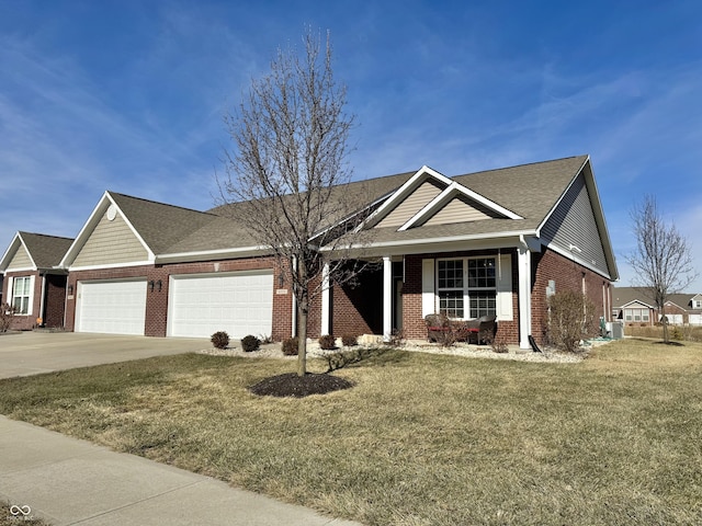 view of front of property featuring a garage, central AC, and a front yard