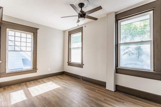 3543 N Kenwood Ave, Indianapolis, IN 46208 - empty room featuring wood finished floors, healthy amount of natural light, and ceiling fan