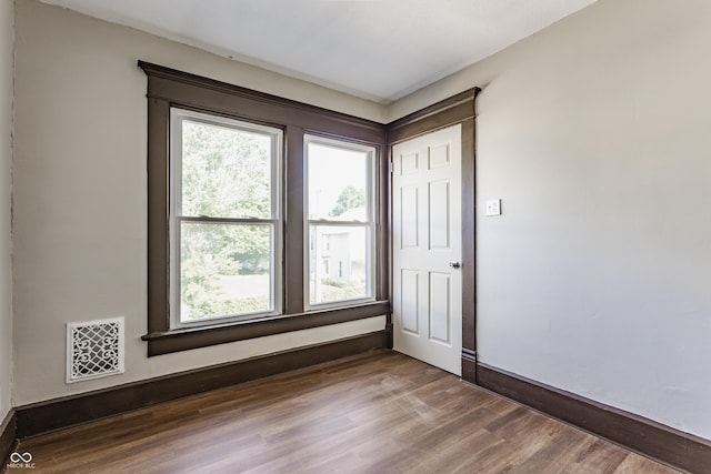 3543 N Kenwood Ave, Indianapolis, IN 46208 - empty room featuring plenty of natural light and wood finished floors