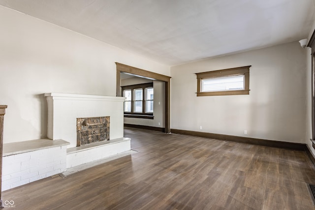 3543 N Kenwood Ave, Indianapolis, IN 46208 - unfurnished living room featuring a brick fireplace and wood finished floors