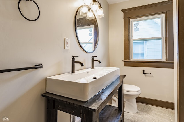 3543 N Kenwood Ave, Indianapolis, IN 46208 - bathroom featuring vanity, a chandelier, and plenty of natural light