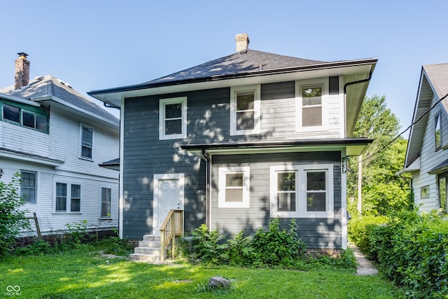 3543 N Kenwood Ave, Indianapolis, IN 46208 - view of front of property with a front yard and a chimney