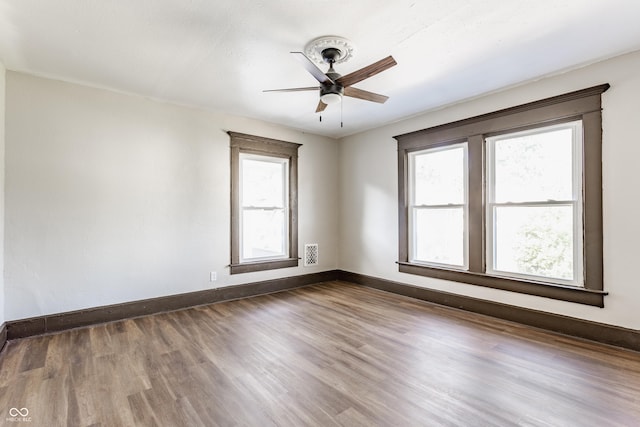 3543 N Kenwood Ave, Indianapolis, IN 46208 - empty room with a ceiling fan and dark wood finished floors