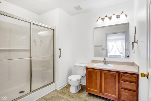 full bath with toilet, visible vents, vanity, baseboards, and a shower stall