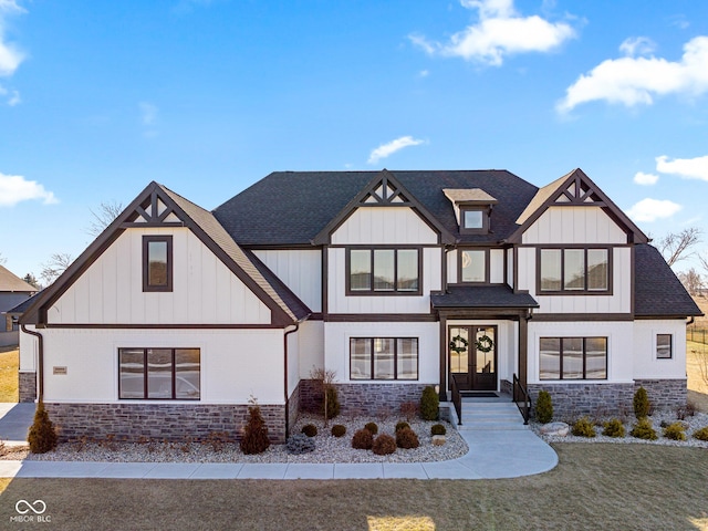 view of front of property featuring a front lawn and french doors