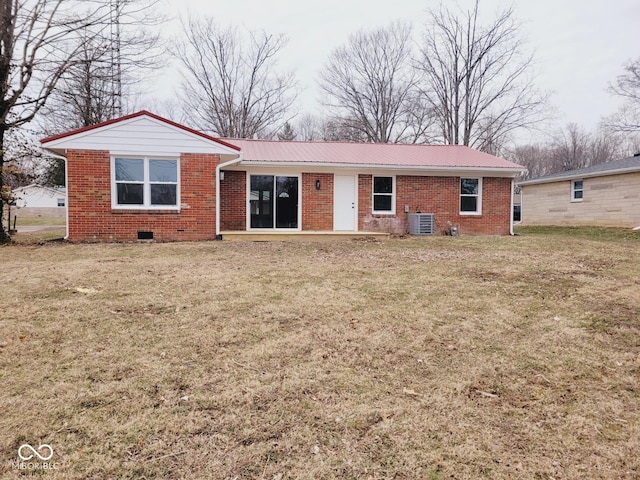 view of front facade with central AC and a front yard